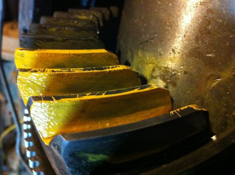 1989 Ford Bronco - Close-up view of yellow-coated ring and pinion gears, likely for automotive use.