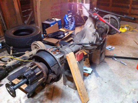 1989 Ford Bronco - Rear axle assembly with brake drum and hub, likely for a truck or large SUV, older vehicle.