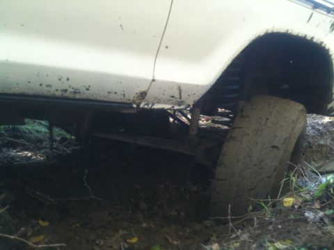 1978 Ford Bronco - This 1978 Ford Bronco is stuck in the mud, showing its rear tire and suspension system.