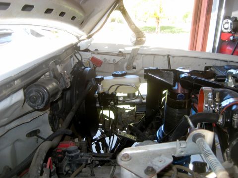 1996 Ford Bronco - Close-up of the engine bay, focusing on the brake system components and associated plumbing.