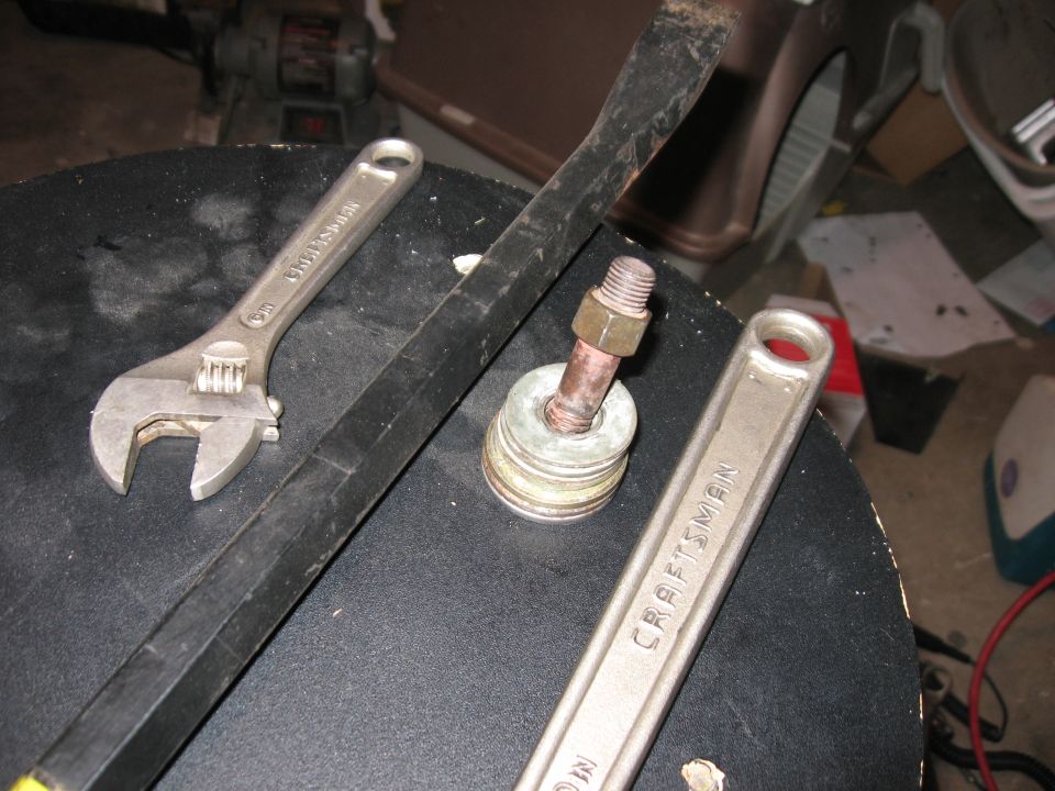 Found a bolt that fit the thread on the end of the cam, and used a stack of washers to help press it on.
