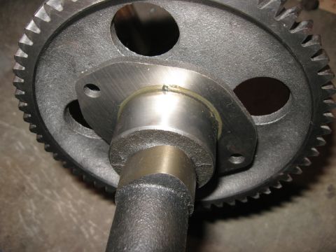 1981 Ford Bronco - A close-up of a camshaft gear and shaft, showing mechanical components.