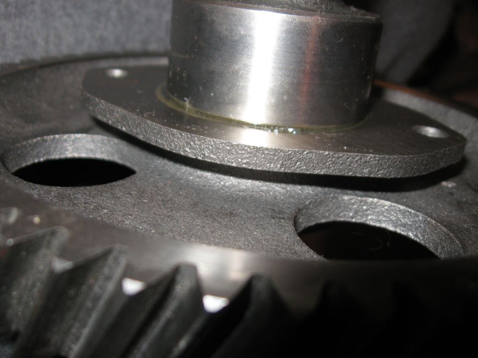From what I heard, the spacer is only 0.005" thicker than the thrust plate.  Not much at all, but the thrust plate spins freely.