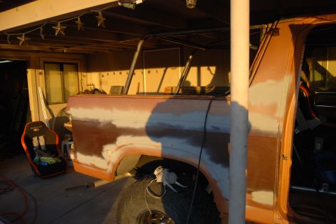 1982 Ford Bronco - The vehicle is in a garage or workshop, undergoing bodywork and preparation for a new paint job.