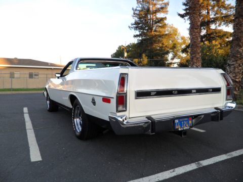 1973 Ford Ranchero - Rear view of a white 1973 Ford Ranchero with chrome bumper and California license plate.