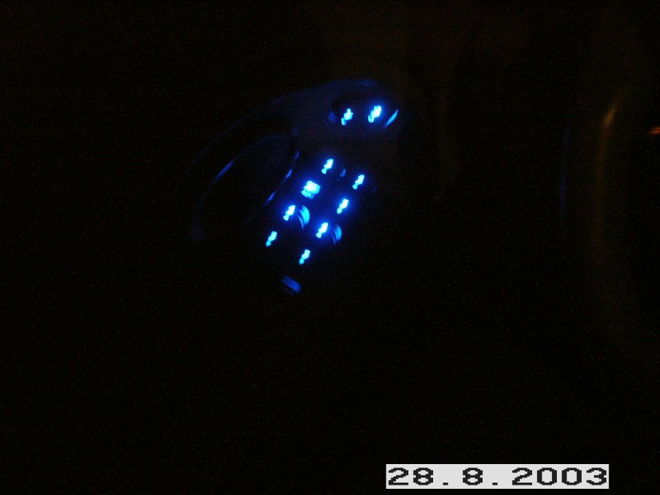 Blue illuminated LED keypad glowing in the dark