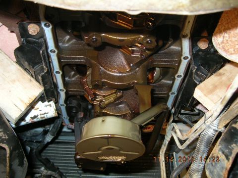 1997 Ford F-250 - The engine's oil pan has been removed, revealing the crankshaft and connecting rods. A date stamp shows 11/14/2010.