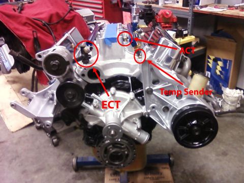 1990 Ford Bronco - Engine block with labeled sensors ACT, ECT, and Temp Sender.