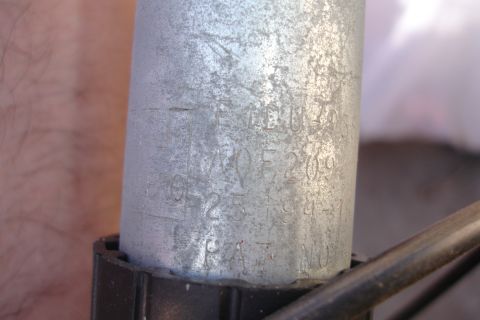1990 Ford Taurus - Close-up of a metal part with stamped serial numbers and patent information visible.