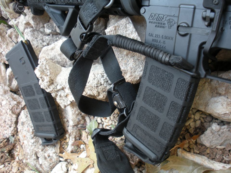 AR-15 rifle with two loaded magazines, one attached to the rifle and one loose
