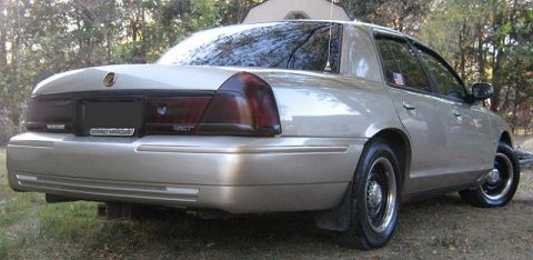 2000 Mercury Grand Marquis - Rear view of a tan 2000 Mercury Grand Marquis sedan.