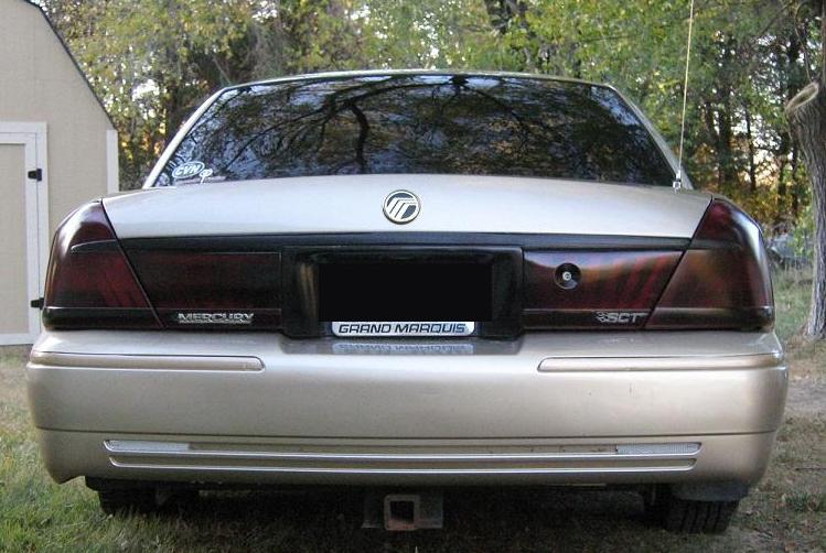 Gold 2000 Mercury Grand Marquis rear view with tinted taillights