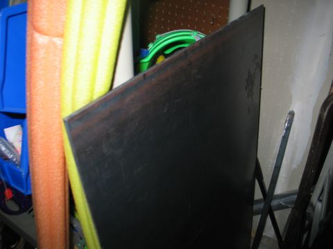 1984 Ford Bronco - Sheet metal and pool noodles are visible in this storage area.