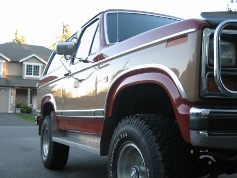 1984 Ford Bronco - This Ford Bronco features a two-tone paint scheme with chrome accents and off-road tires.