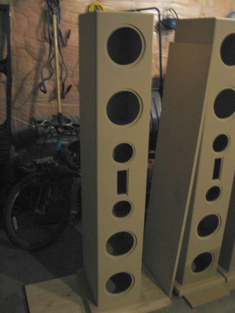 1987 Ford Bronco - Unfinished speaker enclosures are shown in a workshop setting.