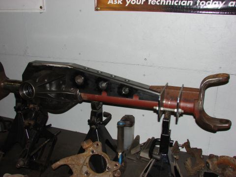 1996 Jeep Grand Cherokee - Rear axle assembly, likely modified, supported by jack stands in a workshop setting.