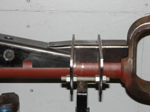 1996 Jeep Grand Cherokee - A close-up view of a metal suspension component, possibly for a vehicle, showing bolted brackets.