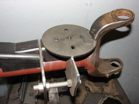 1996 Jeep Grand Cherokee - A custom-fabricated suspension component, likely for off-road modification, is shown mounted on a workbench.