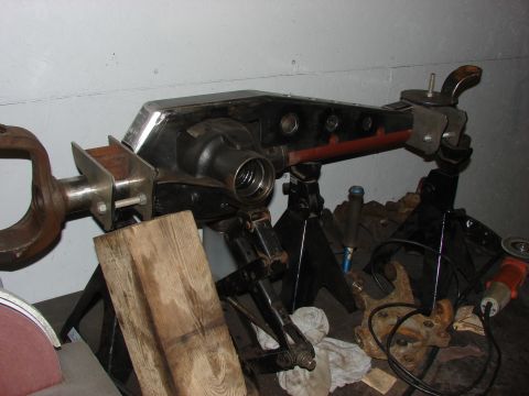 1996 Jeep Grand Cherokee - A disassembled rear axle assembly is supported by jack stands in a workshop environment.