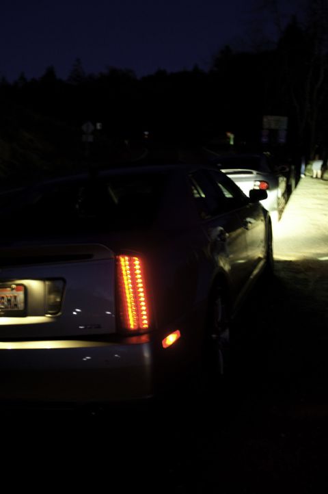 2006 Cadillac STS - Rear view of a Cadillac STS at night, showing its distinctive taillight design.