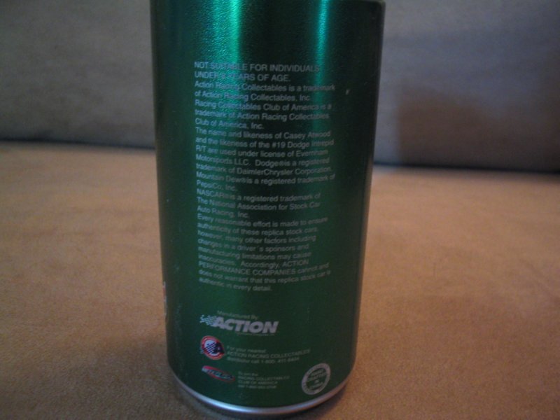 Green can with text detailing Action Racing Collectibles and NASCAR information