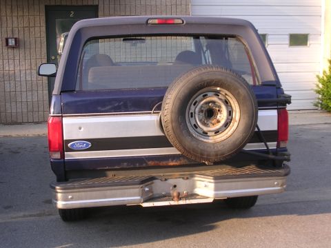 1995 Ford Bronco - Rear view of a Ford Bronco, showing the spare tire and tailgate details.