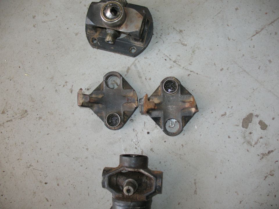 Driveshaft U-joints and yoke on concrete floor