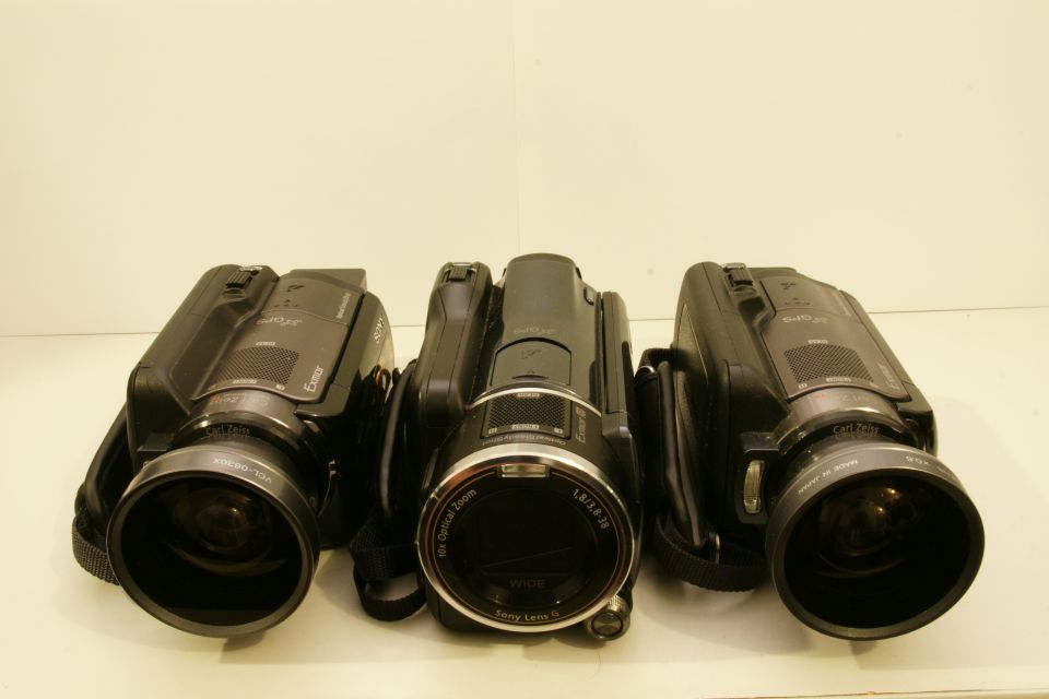 Three Sony camcorders lined up, showing their lenses and bodies