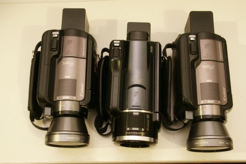 1993 Ford Taurus - Three camcorders are displayed side-by-side, showing their front view with lenses and branding.