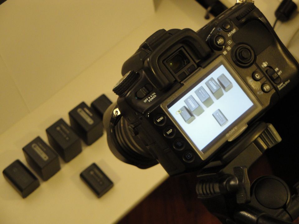 Digital camera with multiple batteries arranged nearby