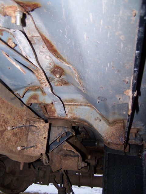 1996 Ford Bronco - Extensive rust is visible on the frame and suspension components of this vehicle.