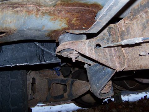1996 Ford Bronco - The undercarriage of this vehicle shows considerable rust on the frame and suspension parts.