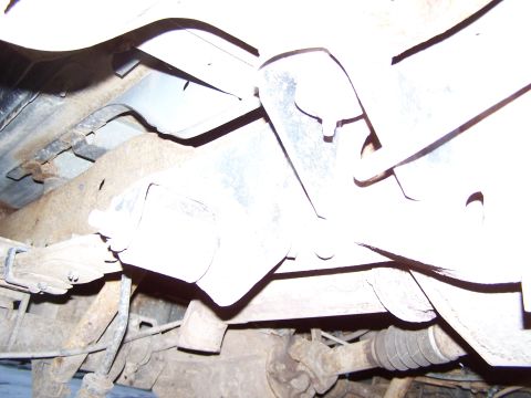 1996 Ford Bronco - Close-up of the undercarriage, revealing suspension and frame components.