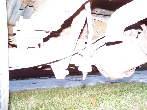 1996 Ford Bronco - Close-up of the undercarriage, showing the rear axle and suspension system.