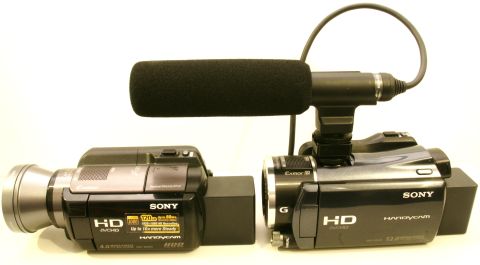 1993 Ford Taurus - Two Sony Handycam camcorders, each equipped with an external microphone, are shown side-by-side.