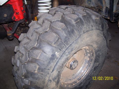 1978 Ford Bronco - A close-up view of a vehicle's tire and suspension components, with visible text overlay.
