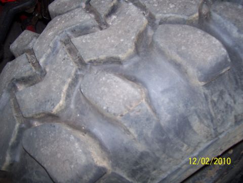 1978 Ford Bronco - A close-up view of a large, aggressive off-road tire tread is visible in this image.