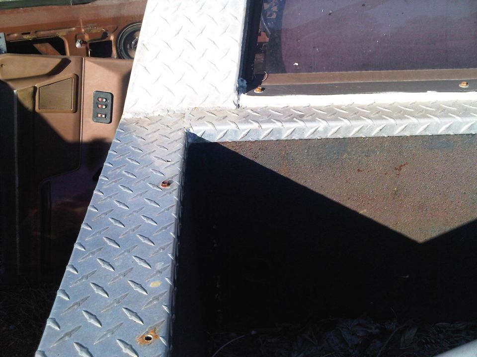 1992 Ford Bronco interior with diamond plate bedliner and door panel