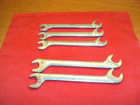 1965 Ford Mustang - A collection of Bonney USA wrenches, some with visible size markings, laid out on a red cloth.