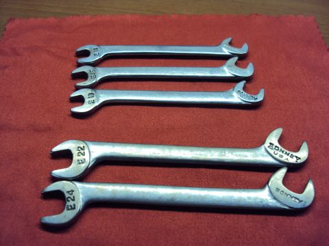 1965 Ford Mustang - A collection of Bonney USA wrenches, including sizes E14, E15, E10, E22, and E24, are laid out on a red cloth.