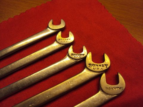 1965 Ford Mustang - A collection of Bonney USA wrenches are laid out on a red cloth surface.