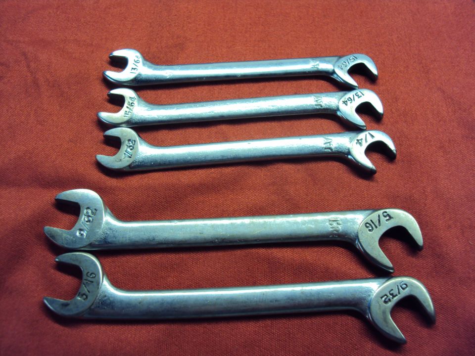 Set of six combination wrenches with fractional inch sizes stamped on them