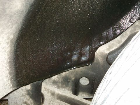 1998 Ford Crown Victoria - Underbody view of a suspected oil leak on vehicle components.