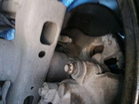 1998 Ford Crown Victoria - Detail shot of vehicle suspension parts, with a watermark indicating the source as Supermotors.net.