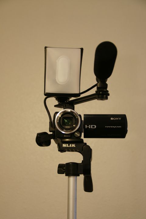 1993 Ford Taurus - A Sony HD Handycam is mounted on a tripod with a microphone and LED light, ready for recording.