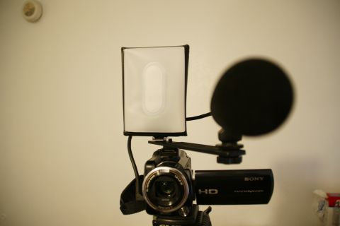 1993 Ford Taurus - A camcorder is set up with a microphone and a light diffuser, ready for recording.