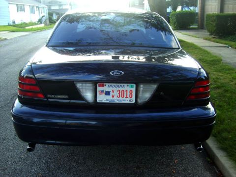 2002 Ford Crown Victoria - Rear view of a 2002 Ford Crown Victoria showing the taillights and license plate.