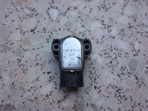 1998 Ford Crown Victoria - Ford throttle position sensor, part number F80F-9E928-AA, is shown against a speckled background.