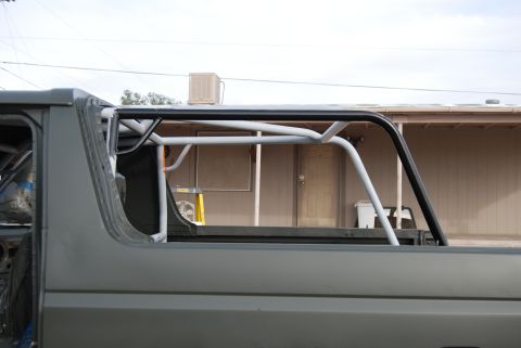 1982 Ford Bronco - This vehicle appears to be undergoing modifications, with a prominent roll cage visible.