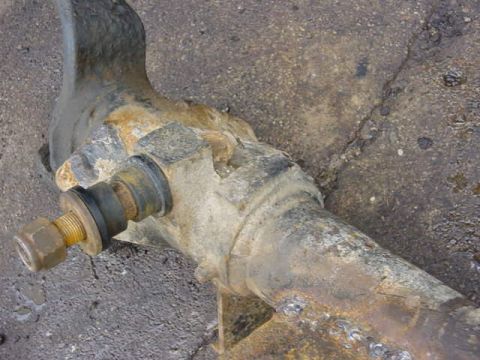 1992 Ford Bronco - Close-up of a heavily rusted suspension component, likely from a vehicle's drivetrain.